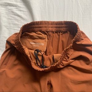 Outdoor Voices retrek pant in orange.